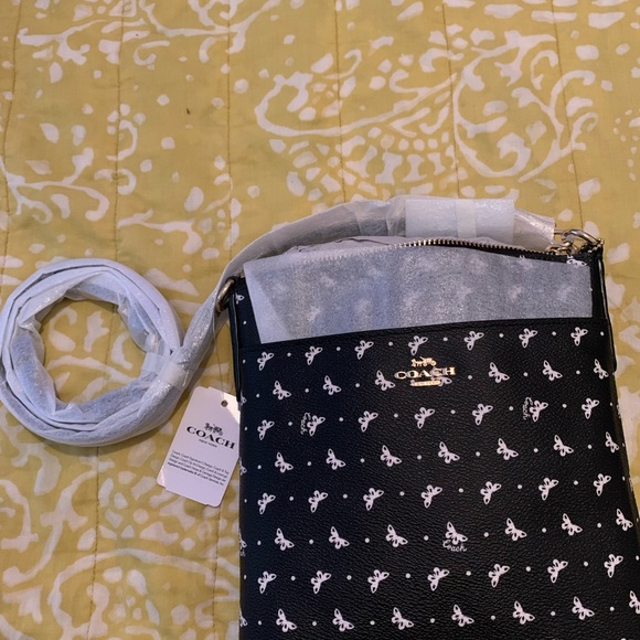 Coach Handbags - Coach Black Multi Butterfly Print - never been used. Has original bag and tags.